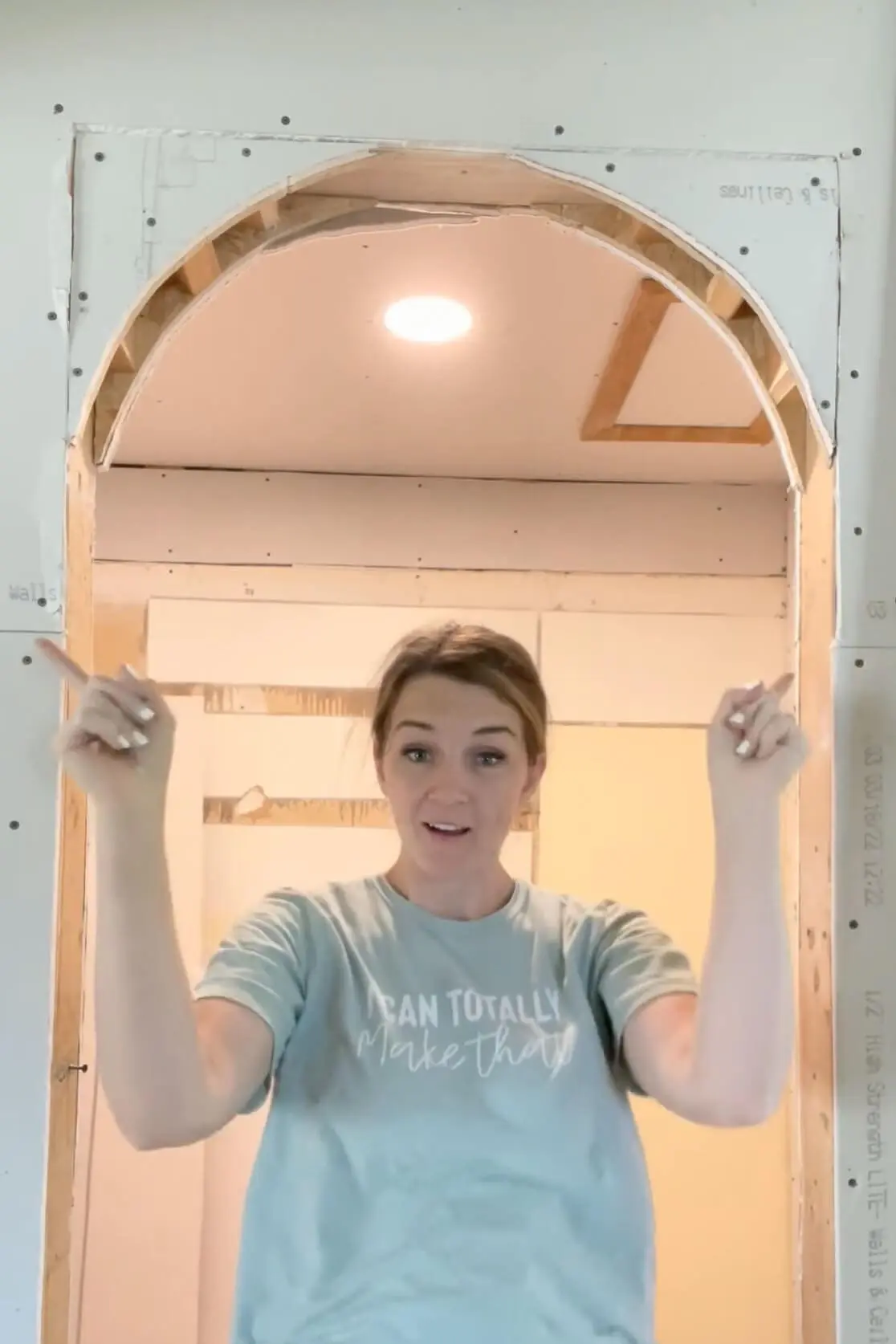 Adding drywall to an arched doorway.